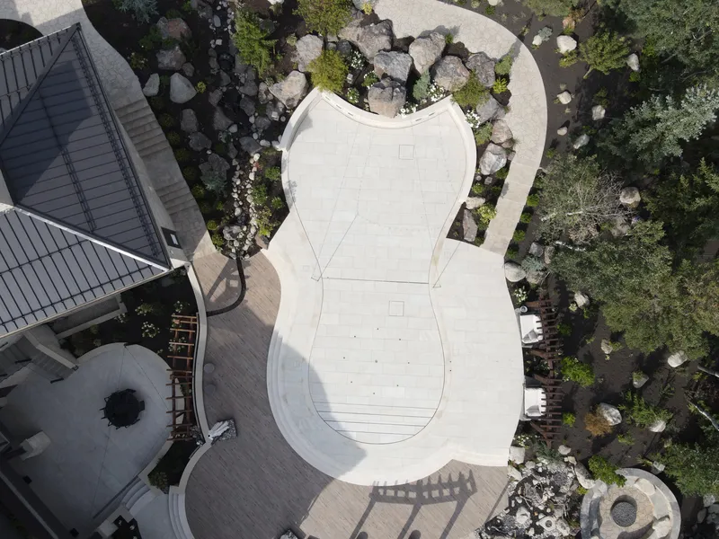 Aerial view of a residential pool and surrounding deck