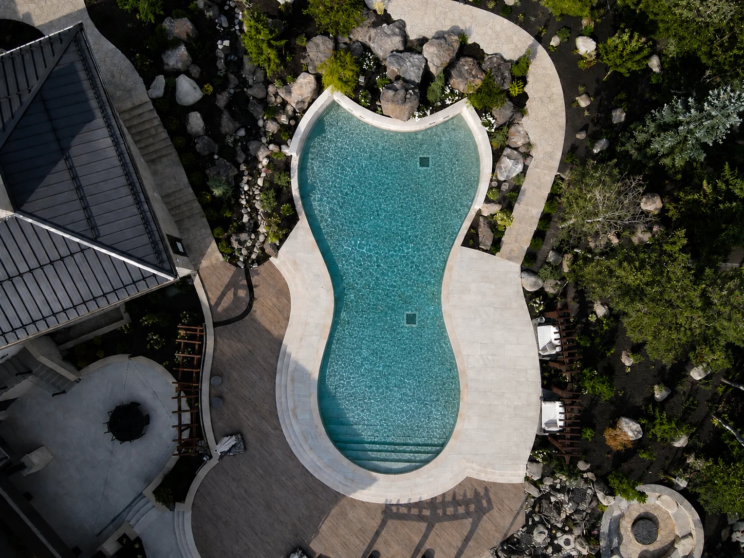 Pool deck and home set against the mountains