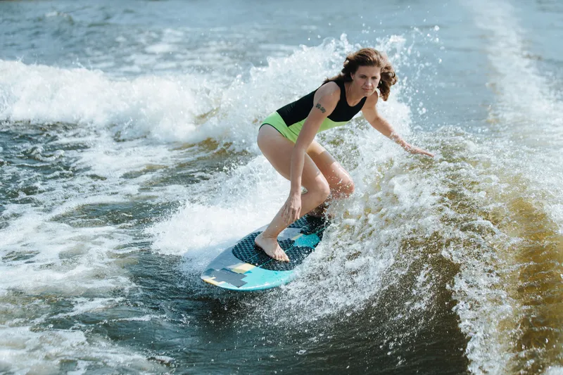 Surfer carving through whitewater